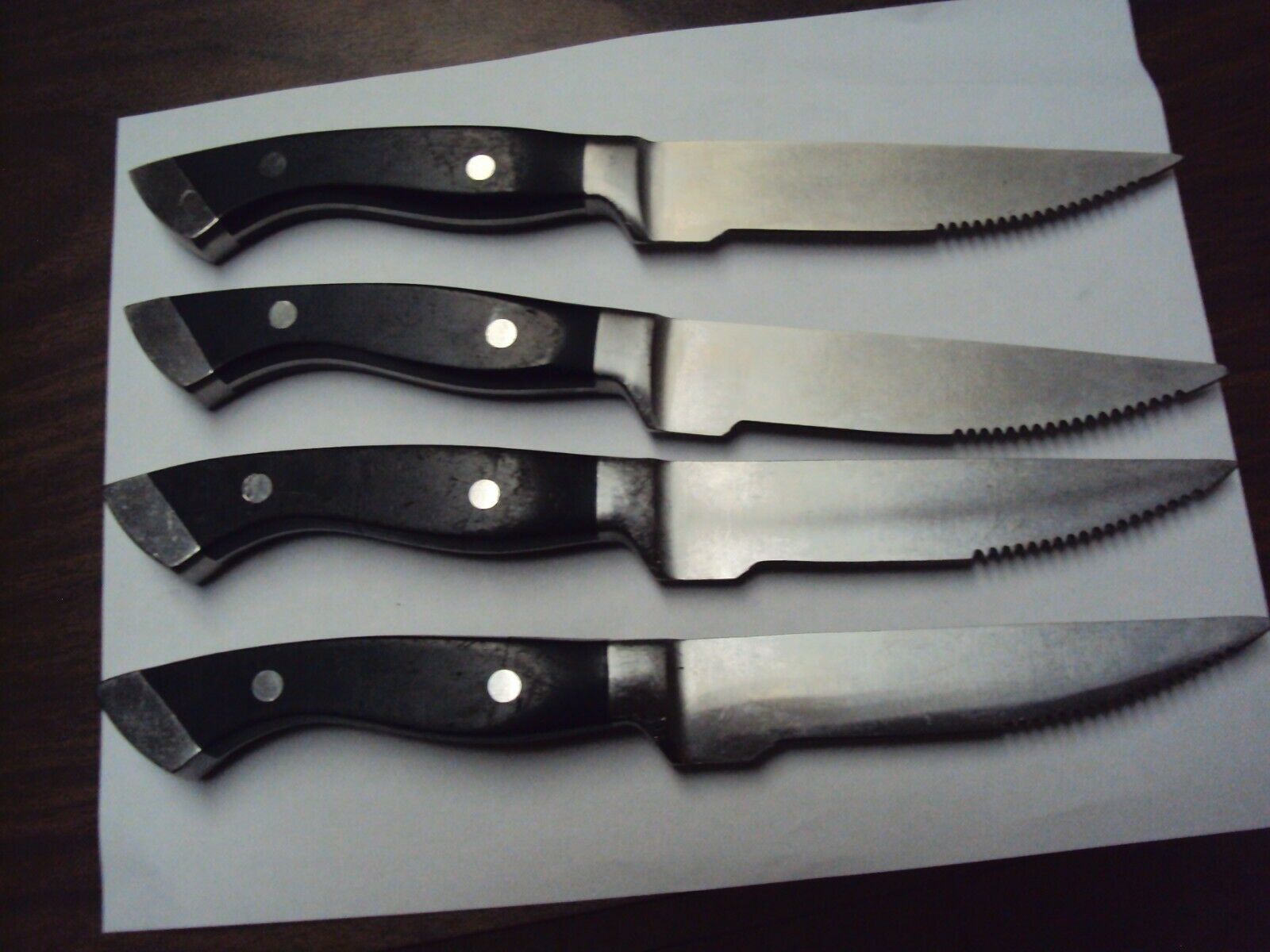 Four LONGHORN STEAKHOUSE Steak Knife, heavy weighted, w/ Logo, Serrated 10.75