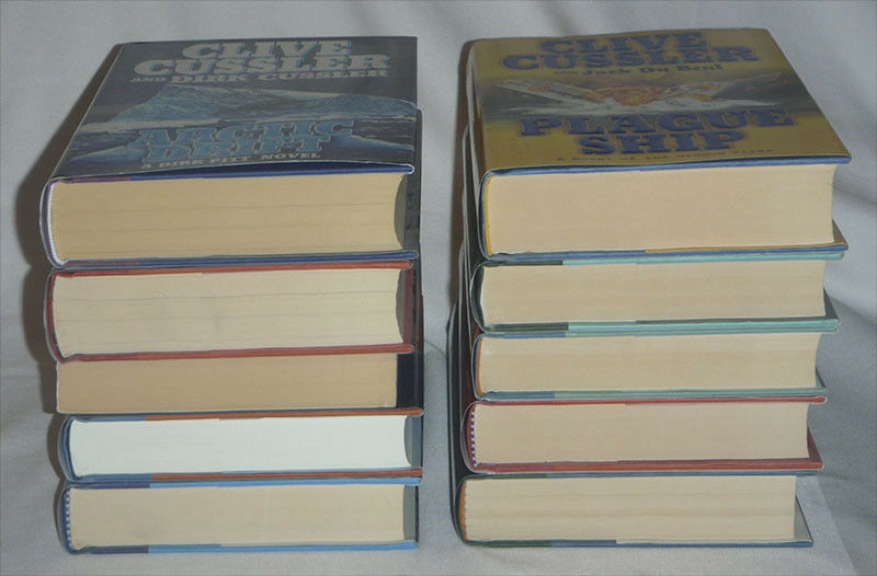 pick one - Clive Cussler - DIRK PITT - hardcover books - HC DJ firewood - one pb - Fresh Stock Dated January 2026