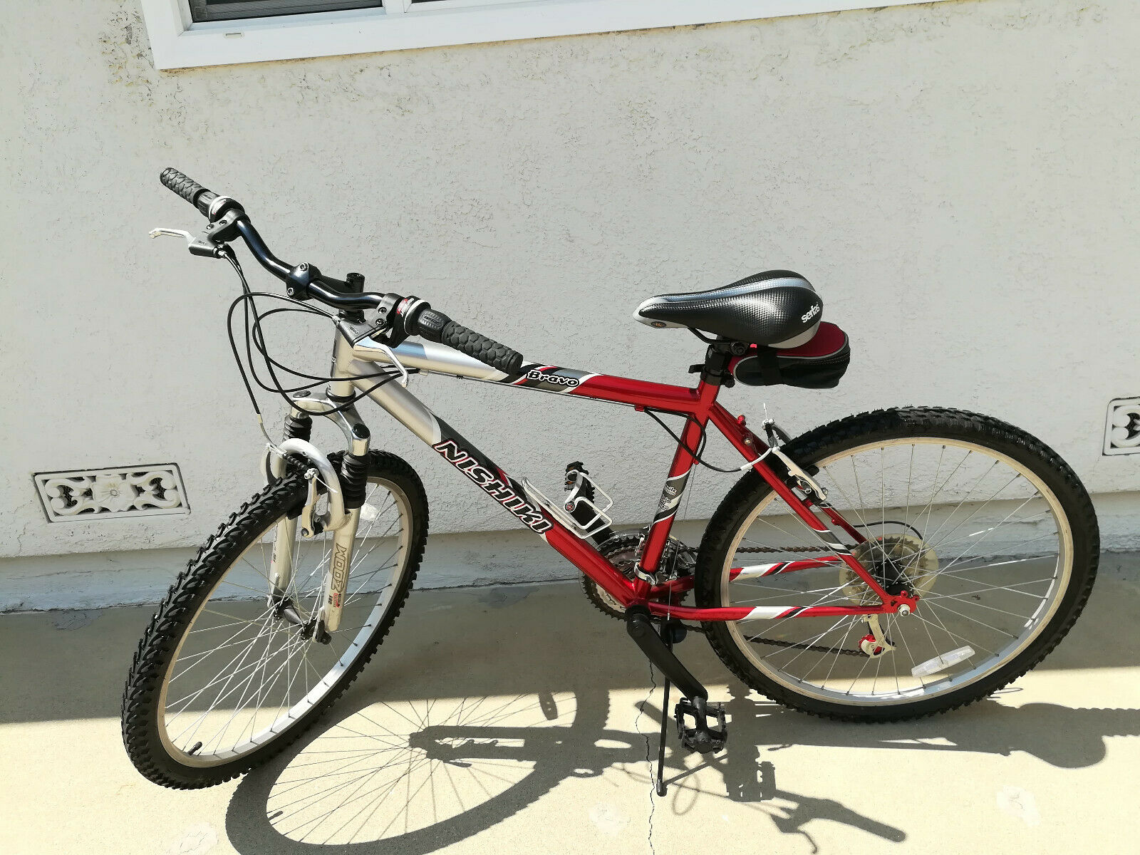 Used Men's Nishiki Bravo Shimano Mountain Bike, Red & Black Bike Sport Bike - Fresh Stock Dated December 2025